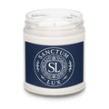 Candle in a jar with a blue label featuring 'Sanctum Lux' on a white background