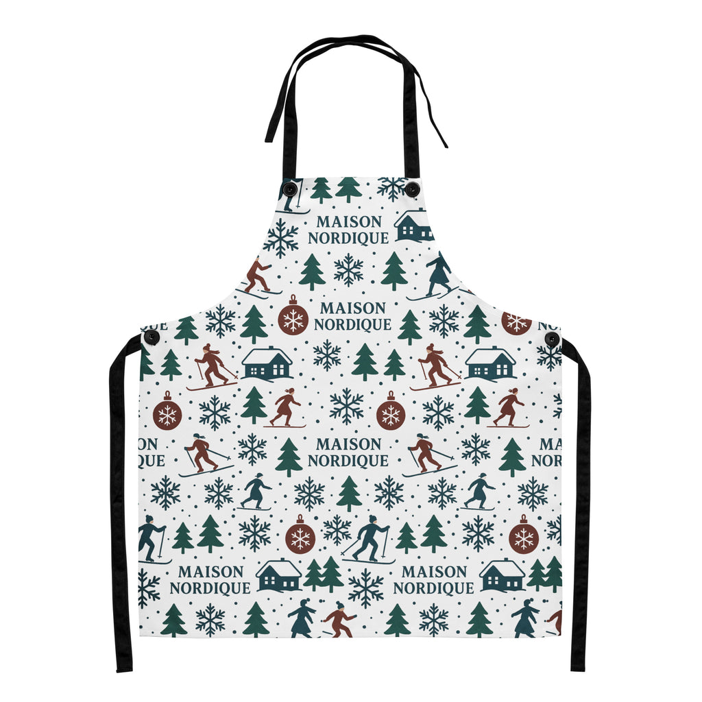 Apron with nordic-themed design featuring trees, houses, and people skiing on a white background.
